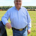 man standing in field